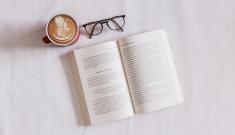 open book, glasses and coffee cup